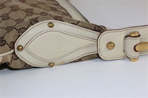 gucci gg canvas pelham studded hobo bag|used gucci signature hobo bag.